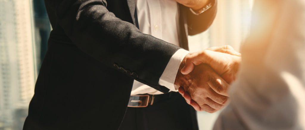 a business man shaking hands with his CPA after receiving a business valuation