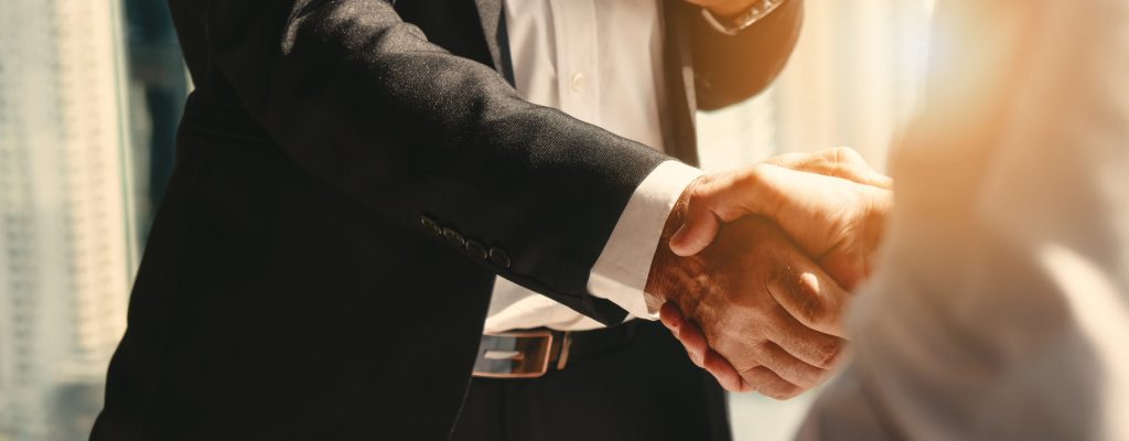 a business man shaking hands with his CPA after receiving a business valuation